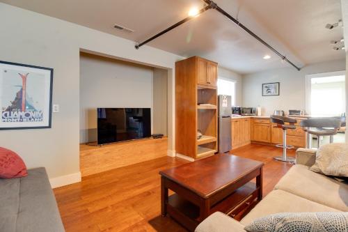 a living room with a couch and a table at Sisters Retreat Upper Lower in Sisters