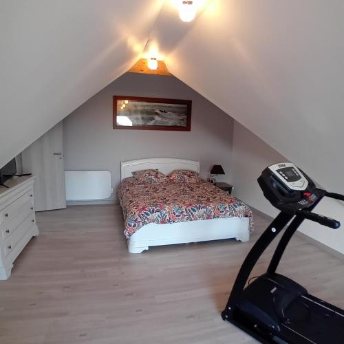 a bedroom with a bed in a attic at Chambres chez particulier in Verneil-le-Chétif