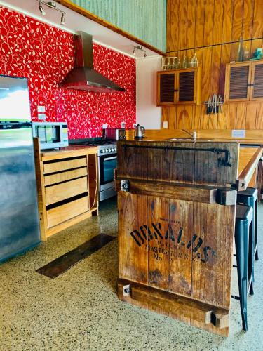 a kitchen with a wooden island in the middle at The Barnhouse Getaway in Roslyn Bush