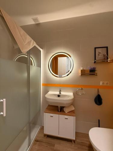 a bathroom with a sink and a mirror at Apartamento Netu - kasasbenas in Benasque