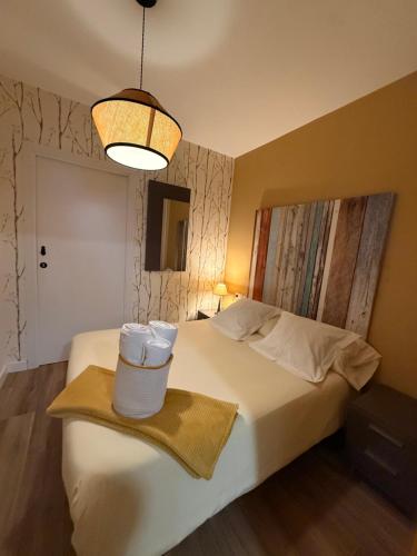 a hotel room with a bed with two towels on it at Apartamento Netu - kasasbenas in Benasque