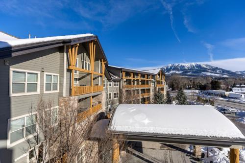 a balcony with snow on the roof of a building at Silver Rock Condominiums by Fernie Central Reservations in Fernie