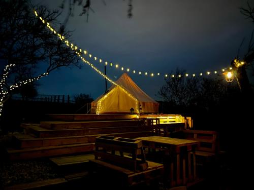 a lit up tent with lights in the dark at Osada na hůrce in Hustopeče