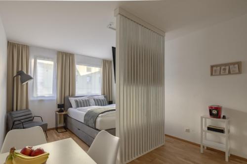 Postel nebo postele na pokoji v ubytování EA-Modernes Studio nähe Hauptplatz