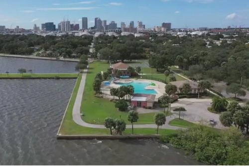an aerial view of a resort with a pool in the water at Channel Side, Down Town Tampa ,Ybor Palmetto Beach, Hot tub, with pickle ball court in Tampa