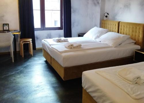Ένα ή περισσότερα κρεβάτια σε δωμάτιο στο Chillout Hostel Zagreb