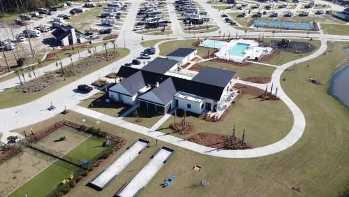an aerial view of a building in a parking lot at Savannah Lakes RV Resort in Hardeeville