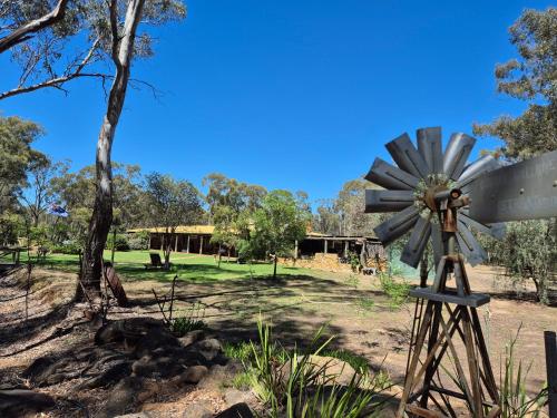 a windmill in the middle of a park at Gunyah Valley Retreat in Goornong