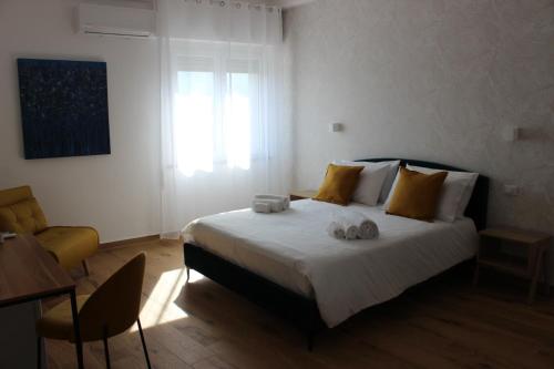 Letto o letti in una camera di Cinquantotto Cozy Rooms