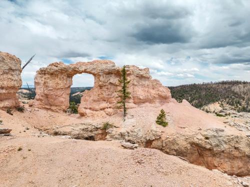 an arch in a rock formation in the desert at Bryce Canyon Retreat in Hatch