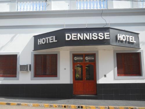 a hotel building with a sign that reads hotel demise at Dennisse Hotel in Victoria