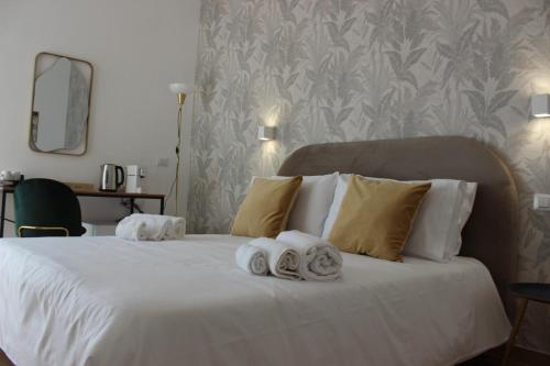 Letto o letti in una camera di Cinquantotto Cozy Rooms