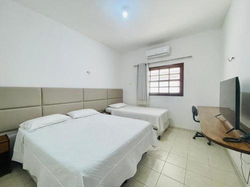 Postel nebo postele na pokoji v ubytování Hotel - Apart-hotel Chalé Executivo