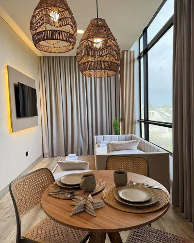 a living room with a dining room table with chairs at Almare Apartamentos nuevos in Gustavo Rojas Pinilla International