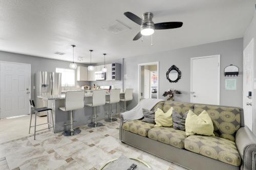 a living room with a couch and a kitchen at North Las Vegas Hideaway with Grill Less Than 10 Mi to Strip in Las Vegas