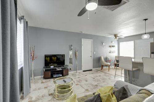 a living room with a couch and a tv at North Las Vegas Hideaway with Grill Less Than 10 Mi to Strip in Las Vegas