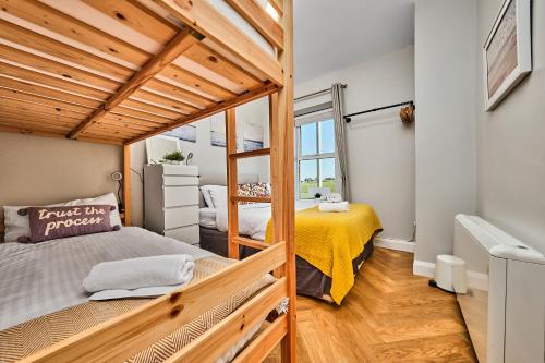 a small bedroom with a bed and a window at Dunluce Park 3 - Portrush by the Sea in Portrush