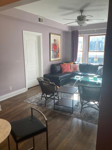 a living room with a couch and chairs and a table at Dorothy's in Chicago