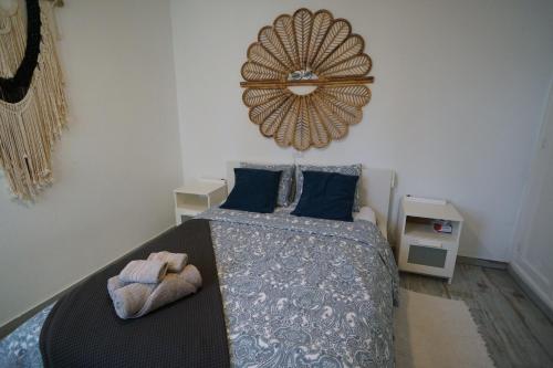a bedroom with a bed and a mirror on the wall at Casa del Capitan in Costa Calma