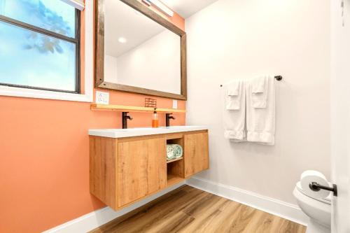 a bathroom with a sink and a mirror at Boutique Beach Retreat in St Pete Beach