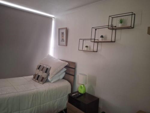 Cama o camas de una habitación en Cómodo departamento
