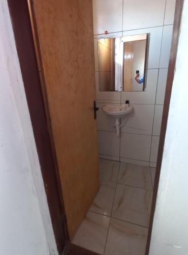 a bathroom with a toilet and a sink at Casa Brisa do Mar in Tamandaré
