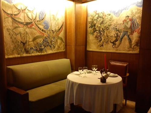 a table in a restaurant with a white table cloth at Hotel Miradouro in Porto