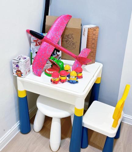 a toy desk with a box and a toy airplane at Skudai - The 9 Homestay near UTM, Kangkar Pulai in Skudai