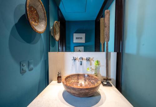 a bathroom with a large bowl sink on a counter at Hacienda De Mita, Close to Ocean and Golf in Punta Mita