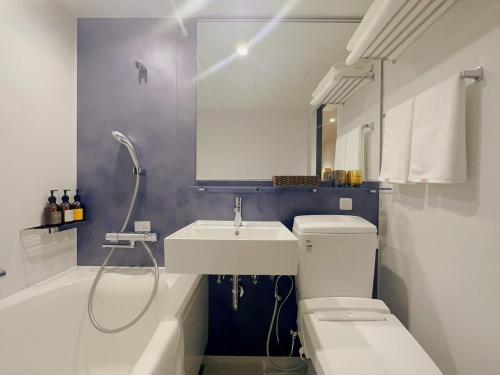 Koupelna v ubytování SAKURAKICHI Hotel