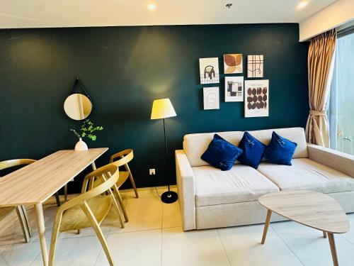a living room with a couch and a table at The Song Boutique Apartment in Vung Tau