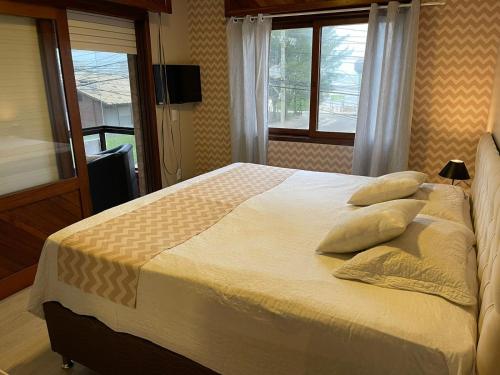 Ένα ή περισσότερα κρεβάτια σε δωμάτιο στο Apto 4D Frente Beira Mar