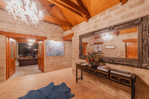a bathroom with a large mirror and a sink at 1BR Retreat Self-Contained & Private - Waitaki in Lake Tekapo