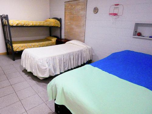 a hospital room with two beds and a basketball hoop at cabaña en la naturaleza in Futrono