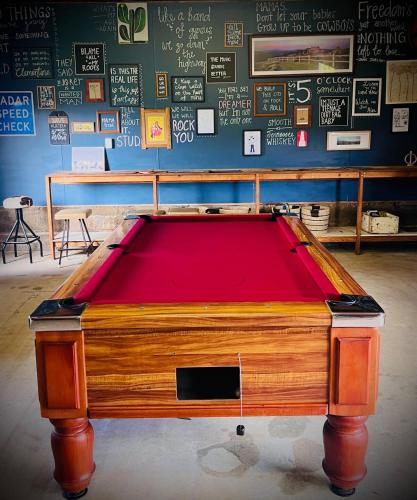 a pool table with a red top in a room at York Huon Farmhouse in Lower Botobolar