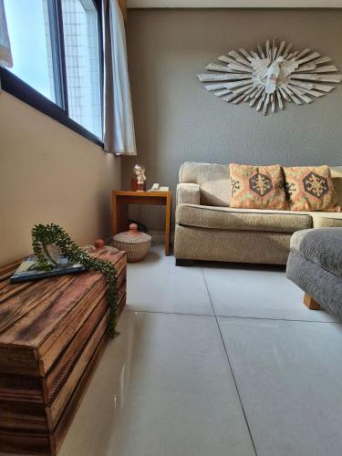 a living room with a couch and a table at Flat Santana próximo ao metrô (Apto 135) in Sao Paulo