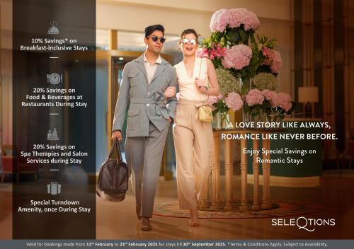 a man and a woman standing next to a bouquet of flowers at Savoy - IHCL SeleQtions in Ooty