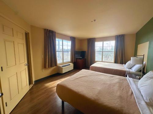 Ένα ή περισσότερα κρεβάτια σε δωμάτιο στο MainStay Suites Las Vegas Flamingo