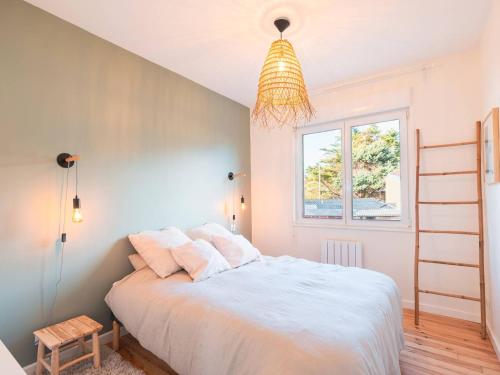 a bedroom with a white bed and a window at Charmante maison 3 chambres Quentovic, WiFi - FR-1-821-11 in Le Touquet-Paris-Plage