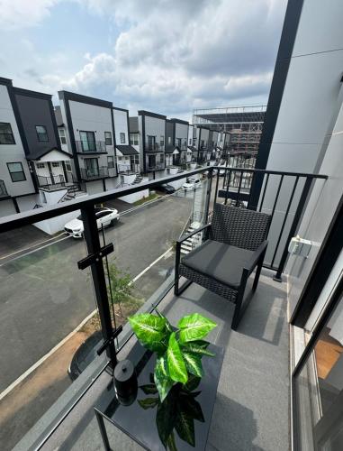 a balcony with a chair and a view of a street at Luxury Gated NYC Theme 3BR 2B with Parking by EWR in Elizabeth