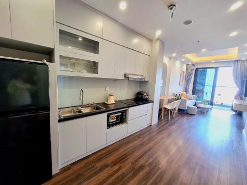 a kitchen with a sink and a counter top at TC Apartment & Homestay in An Khê