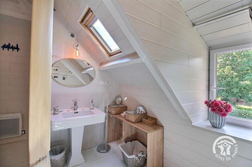 a bathroom with a sink and a mirror at La villa de la lieue de greve in Plestin-les-Grèves