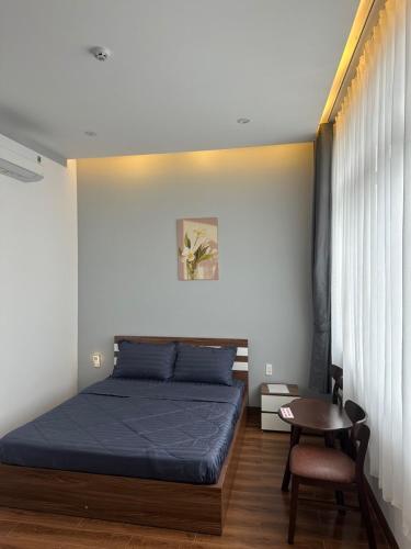 Ένα ή περισσότερα κρεβάτια σε δωμάτιο στο Home Anh Thy