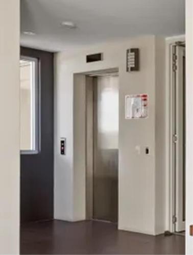 a hallway with an open door in a building at Keith's on Pumicestone, 1 of the 3 most popular units on Bribie in Bongaree