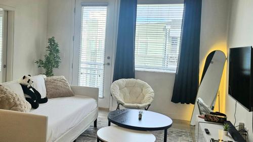 a living room with a couch and a table at Resort style 1 King and Twin Apt w Gym Pool Hot Tub in Salt Lake City