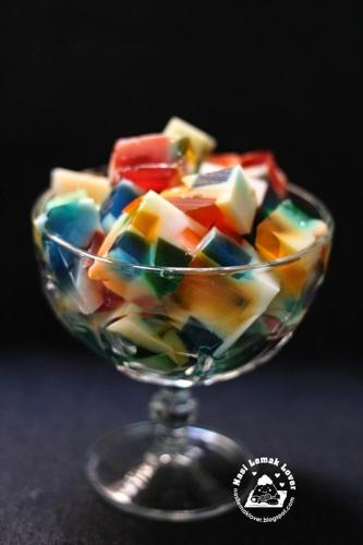 a glass bowl filled with colorful candy on a table at Four Points Resort - Anuradhapura in Anuradhapura