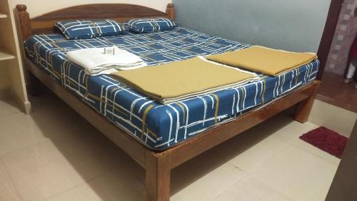 Postel nebo postele na pokoji v ubytování Dwaraka Dharma Stay Hampi