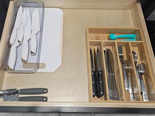 a drawer filled with knives and utensils at Cozy duplex near the Ocala Airport in Ocala