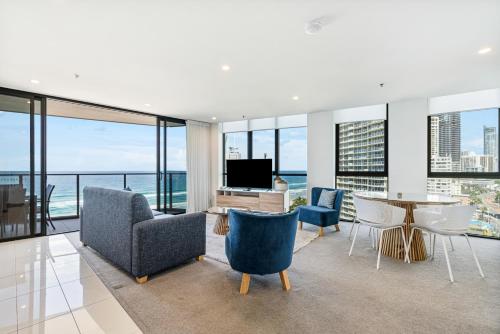 a living room with a view of the ocean at Rhapsody Resort - Official in Gold Coast