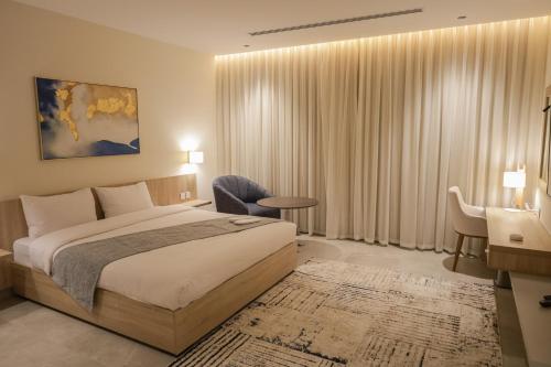 Postel nebo postele na pokoji v ubytování ISHQ Hotel